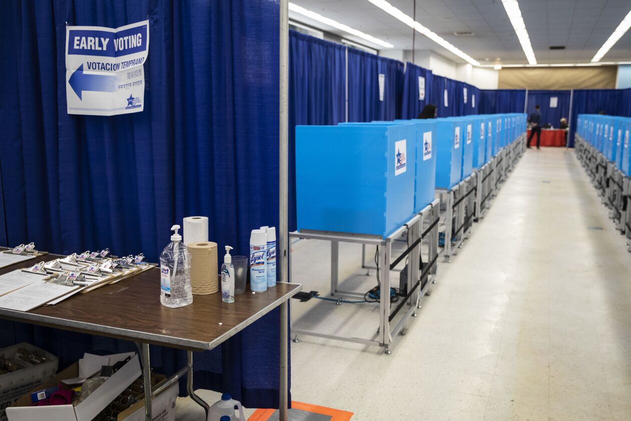 Jugs of hand sanitizer and cans of Lysol greet voters in the March 17 Illinois primary election at the new Loop super site Thursday afternoon.